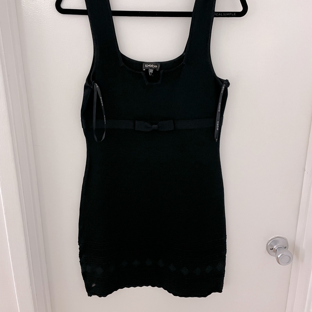 Bebe dress with bow detail geometric patterns at the hem
